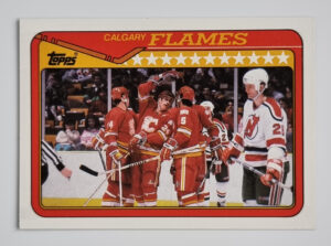 1990-91 Topps #38 Flames Team/Brian Bradley/Jim Peplinski/Dana Murzyn